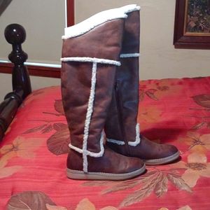 Cognac and fur over the knee boots.